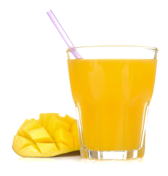 istock Ripe fresh mango fruit and mango juice in a glass on a white isolated background. tropical fruit 1550377411