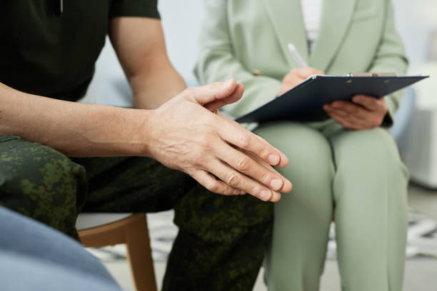 istock Hands of mature man taking psychological course after coming back from war 1550388208