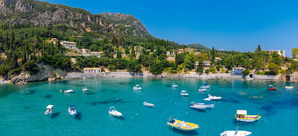 Paleokastritsa bay with boats in Corfu Greece