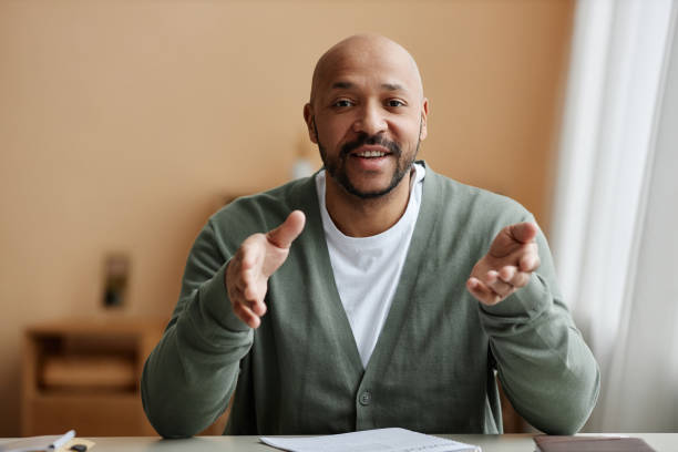istock Black man talking animatedly at camera 1550405226