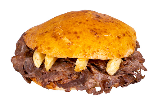 Meat between bread rolls. Meat doner in fat bread isolated on white background. Traditional Turkish cuisine. Close-up. local name tombik et doner