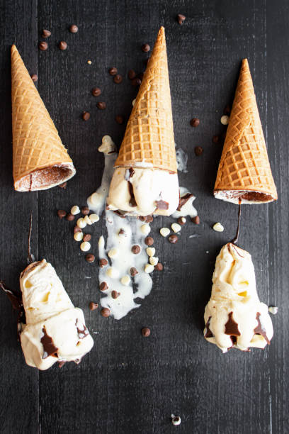 istock Cream ice cream cone,  with pieces of chocolate. 1550415101