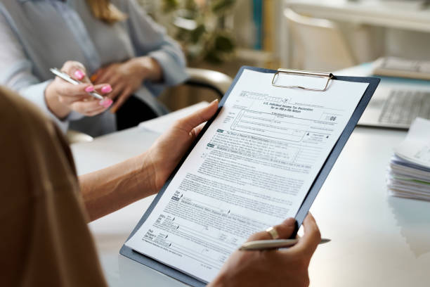 istock Woman examining contract in office 1550421067
