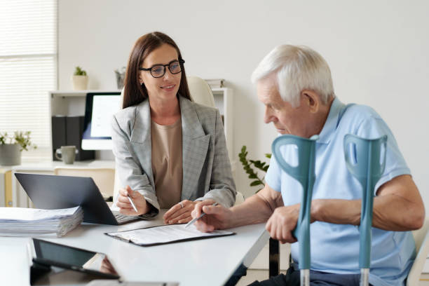 istock Senior man signing insurance contract 1550425483