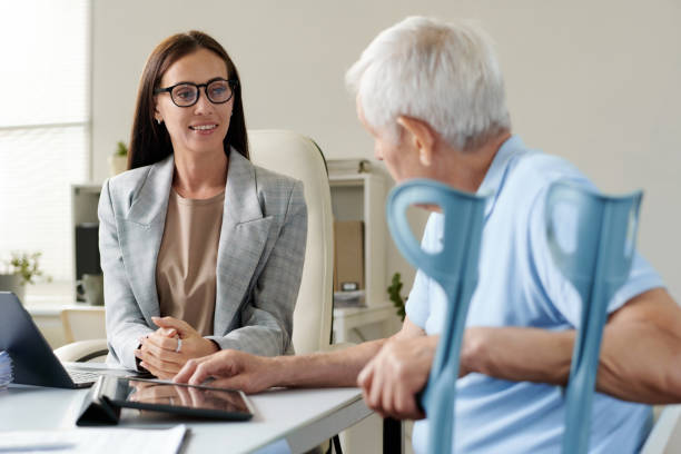 Insurance agent discussing conditions with senior man