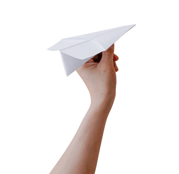 istock Hand holding paper plane isolated on white background with clipping path. 1550450256