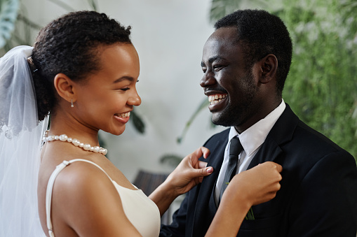 Candid portrait of happy bride and groom meeting before wedding ceremony