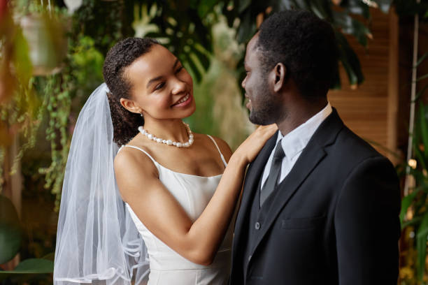 istock Young black couple getting married and looking at each other with love 1550451381
