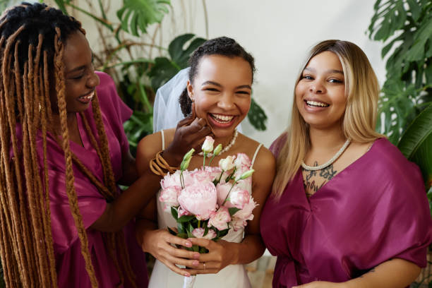 istock Young bride having fun with bridesmaids during wedding party 1550451416