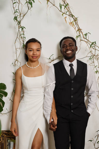 istock Elegant black couple as bride and groom 1550451957