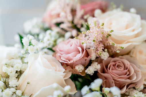 Pretty white, pink and green wedding flowers for bride and groom