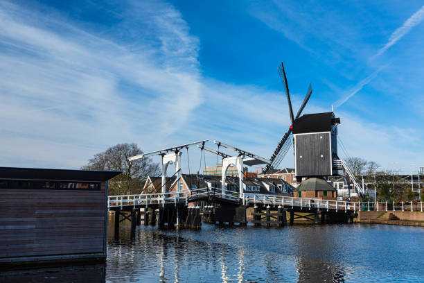 istock Leenbrandt Bridge and De Put Windmills in Leiden, Netherlands 1550482014