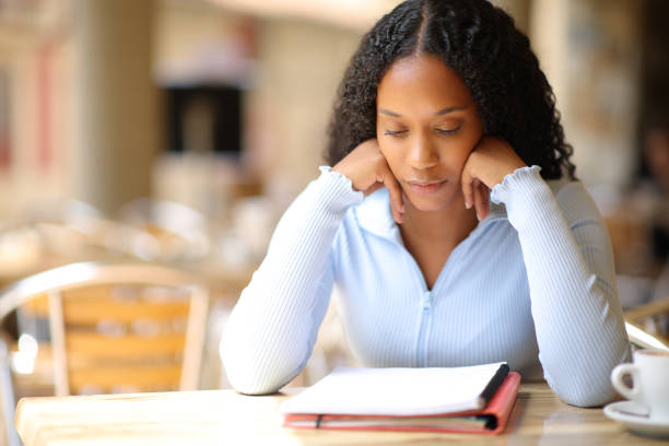 istock Black woman studying in a coffee shop 1550489120