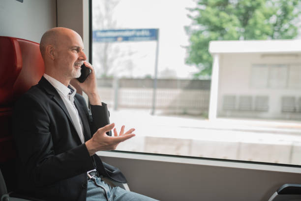 istock man in train on the phone 1550495498