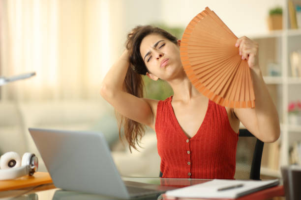 istock Student fanning at home suffering heat stroke 1550496534