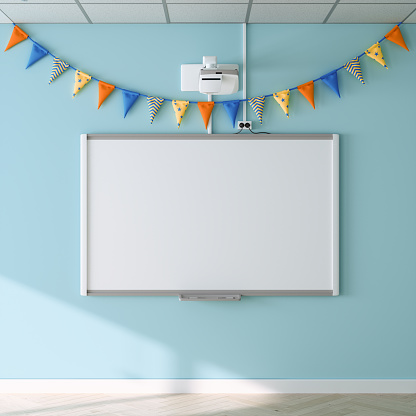 Empty Whiteboard And Colorful Pennants On Blue Wall