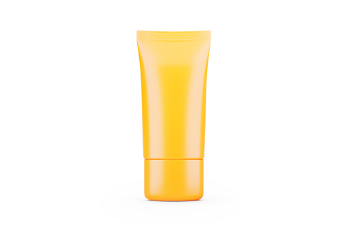 Blank yellow cosmetic tube sitting on white background. Horizontal composition with clipping path and copy space.