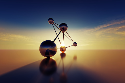 Connected spheres at sunset. Horizontal composition with copy space.