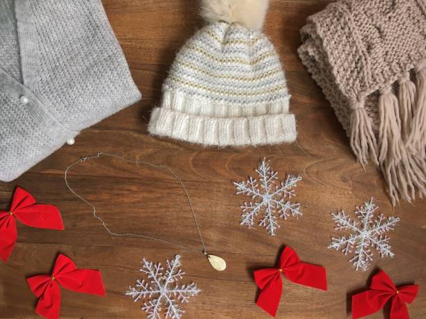 istock Winter concept flat lay. Warm, cozy set clothes on wood background. 1550528998
