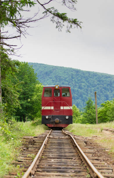 istock an old sightseeing tram among the mountains in the forest, 1550547751