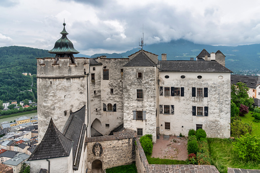 Salzburg, Austria: July 17, 2023 - Perched atop the picturesque hills of Salzburg, the iconic Salzburg Castle stands as a testament to the city's rich history and architectural grandeur. This photo captures the castle's commanding presence and breathtaking views. Photo was taken during a warm summer afternoon.