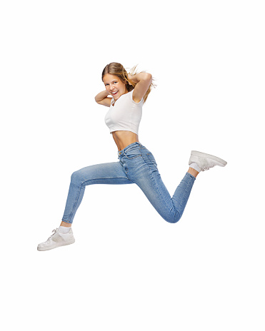 Full size photo of young cheerful teenager girl jump isolated over free white background