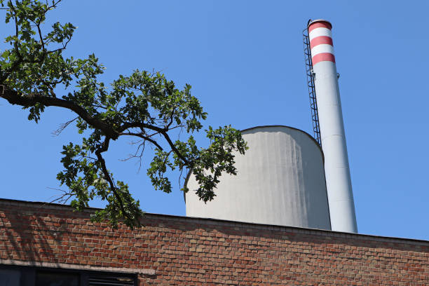 Old tall chimney made of bricks. long and thin clouds in the sky