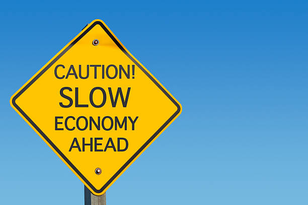 istock Caution Slow Economy Ahead Road Sign 155067040