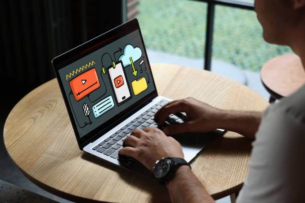 A man is traying to create digital content on her laptop