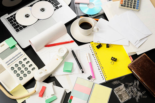 istock High angle view of desktop in a mess intensely 155068110