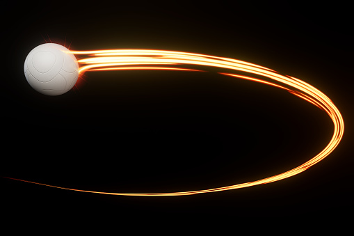 A football sport ball flying through the air with a flowing travelling trail of glowing wispy lights on an isolated background - 3D render