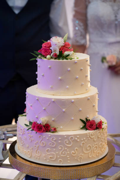 istock Wedding cake, hands and the knife, cutting 1550697417