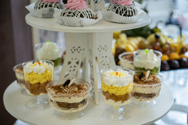 istock Wedding sweets, decorated tables, decorations and cupcakes, delicious meat and delicacies 1550699509