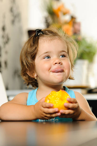 istock little girl eating 155070092
