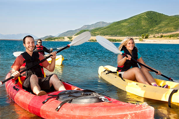 istock Happy smiling friends in Kayaks 155070421