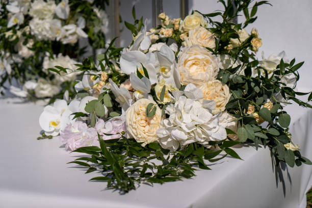 istock Wedding interior restaurant flowers, blossom floral decorations, white bloom for wedding ceremony 1550705902