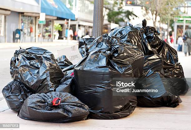 Plastic Bags Full Of Garbage Stock Photo - Download Image Now - Garbage, Garbage Bag, Street