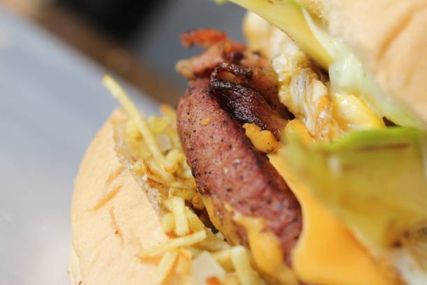 istock Closeup of a freshly-made burger with vegetables and beef 1550715157