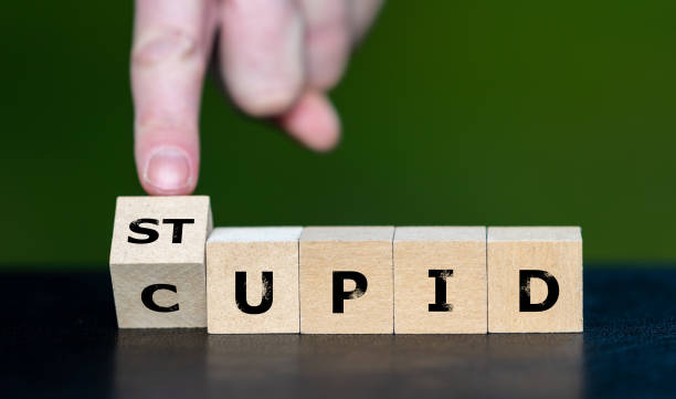 istock Wooden cubes form the words 'cupid' and 'stupid'. 1550716232