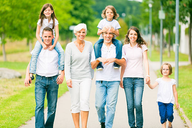 istock big family walking through the park 155072195