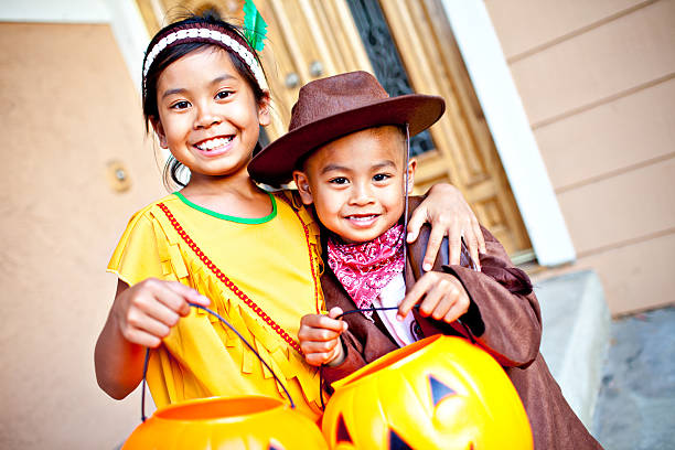 istock adorable halloween indian and cowboy 155072927