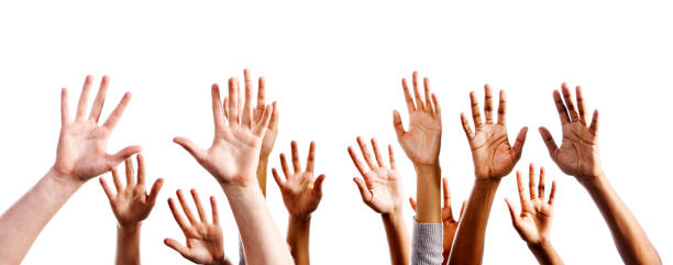istock Twelve mixed hands raised in praise or joy against white 155073627