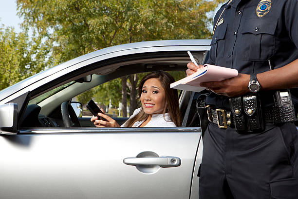 istock Police Officer writing a traffic ticket 155074078