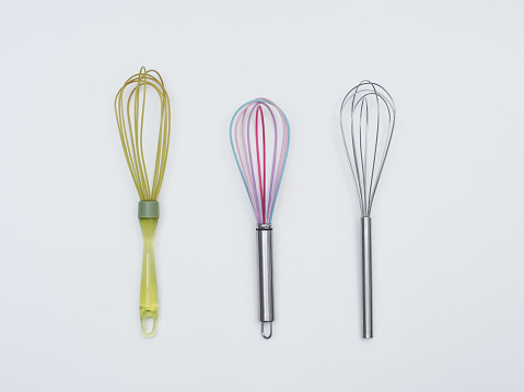 Three different wire whisks, egg beaters