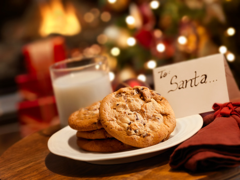 Traditional, greek New Year or Christmas cookies with almonds (kourabies) on a wooden table close-up.