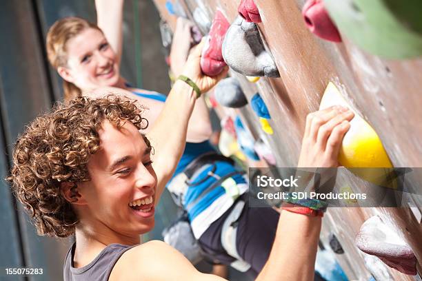 Happy Teenagers Having Fun In A Rock Climbing Gym Stock Photo - Download Image Now - Teenager, Climbing, Climbing Wall