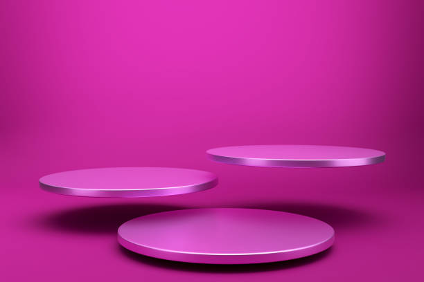 istock Three round cylinder levitating pink podiums on pink background. 1550754252