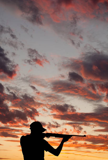 istock Silhouette of Man Shooting a Rifle 155075618