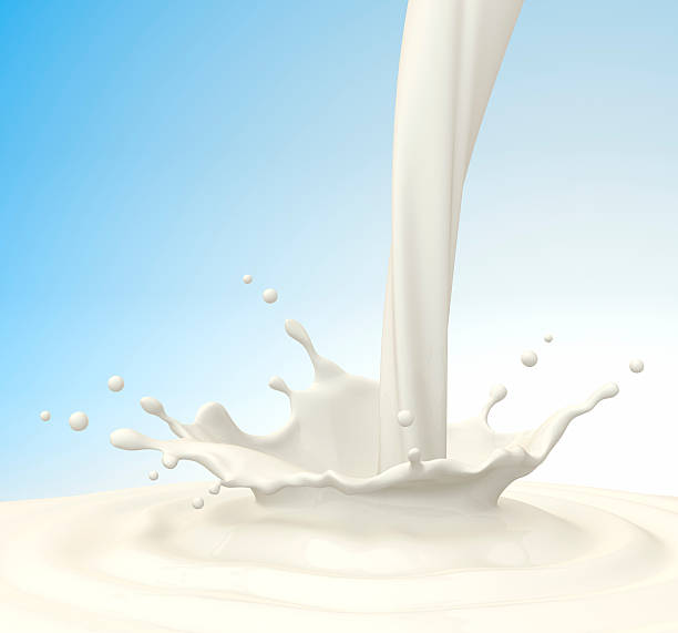 istock Milk pouring from spout into large puddle 155076355