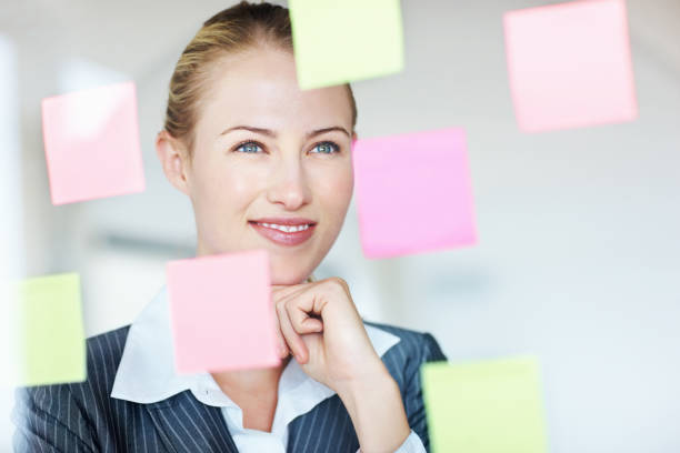 istock Business woman looking at blank notes 155076376